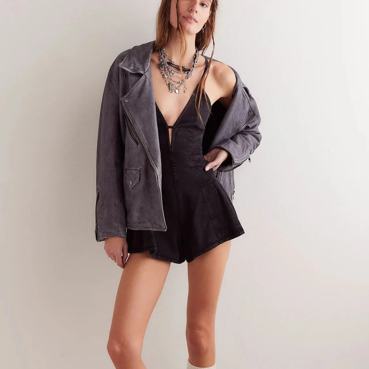 Isla Deep V-Neck Sleeveless Denim Mini Romper with Pleated Skirt Detail