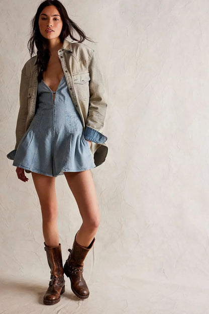 Isla Deep V-Neck Sleeveless Denim Mini Romper with Pleated Skirt Detail